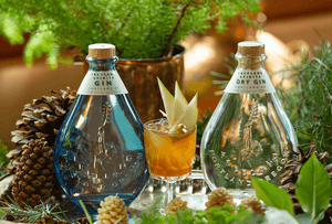 Spiced Pear Fizz Coctail with Gin and Dry Gin Bottles